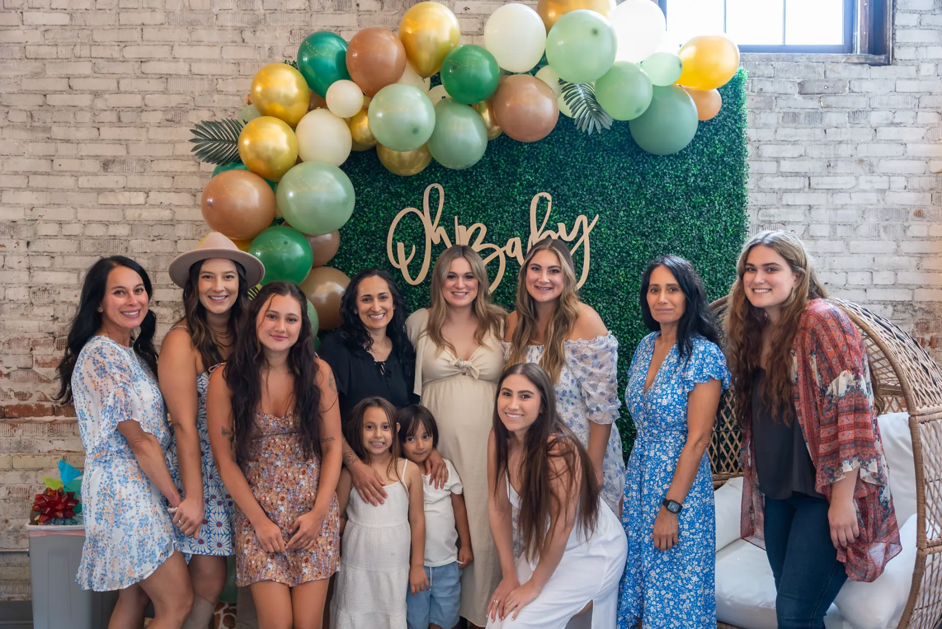 Group of guests gathered together at a baby shower at Host Wenatchee