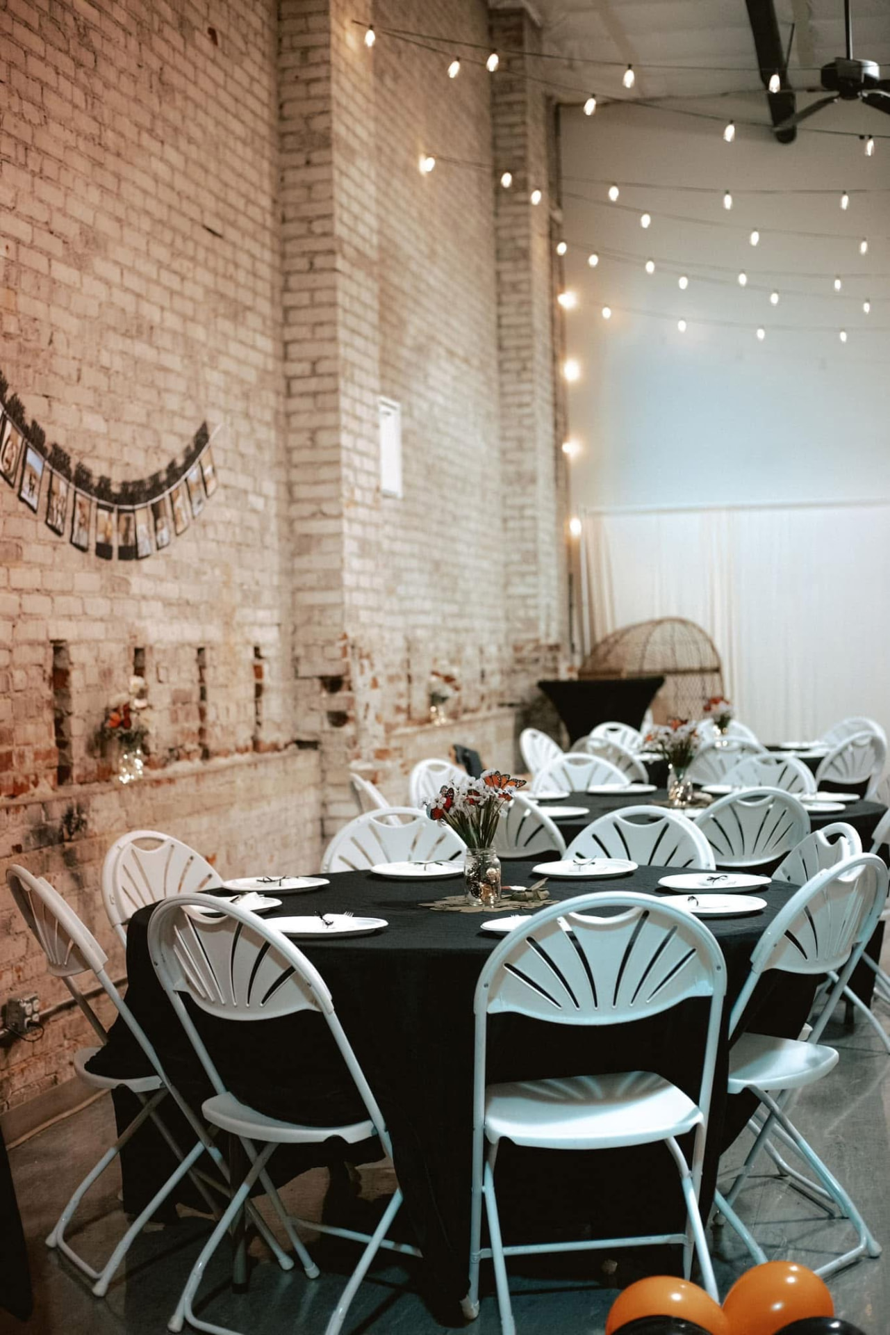 Round tables with black linens set for a corporate dinner at Host Wenatchee