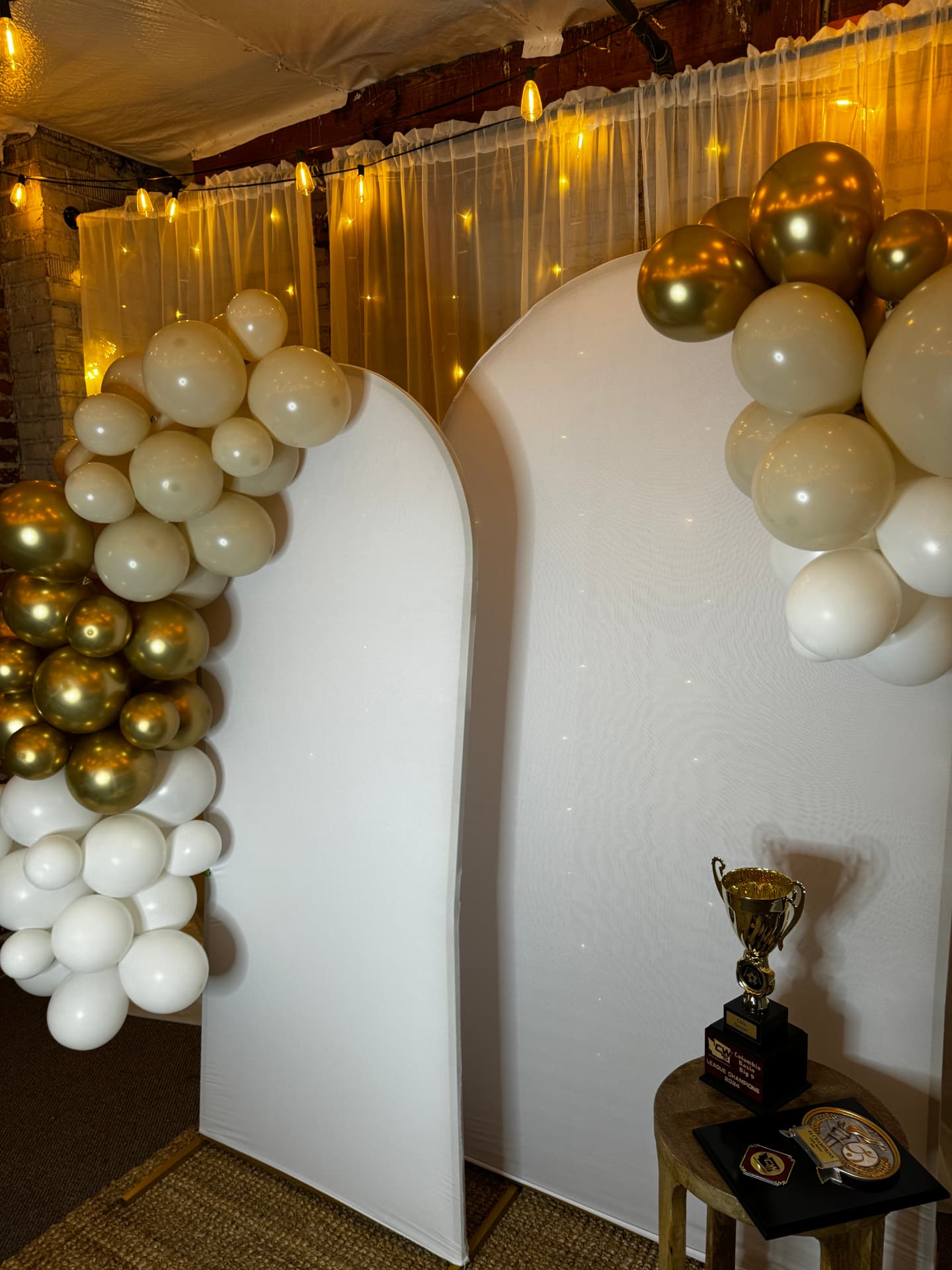 Pastel balloon arches framing the entry at Host Wenatchee